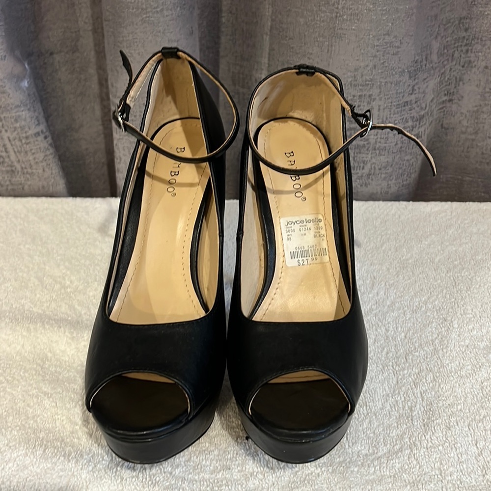 This a size 10 black leather platform heel brand Joyce Leslie